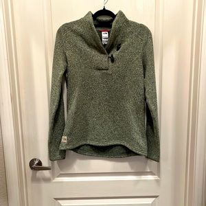Fleece lined fitted green sweater with tusk look a like “buttons”.